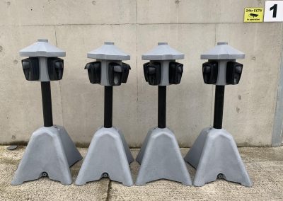 row of four hand sanitiser stations